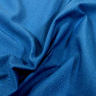 close-up of a thalo blue knit jersey fabric