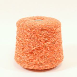 cone of tiger orange colored curly yarn with brown and white flecks