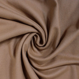 swirl of toffee colored felted wool interlock fabric