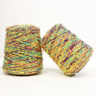 two multicolored raggy eyelash yarn cones