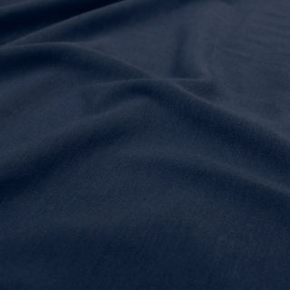 close-up ripple of twilight blue jersey fabric to show texture of knit and hand of the fabric