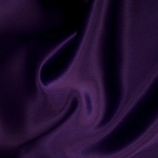 Close-up of purple silk charmeuse fabric with a shiny face