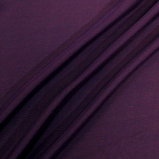 three diagonal lines arranged of a violet colored silk chiffon fabric, demonstrating its soft and airy draping quality