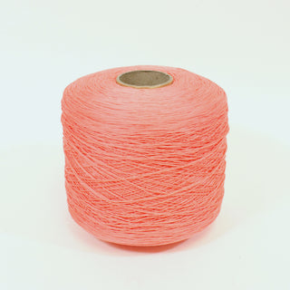large cone of watermelon colored fine-gauge worsted yarn
