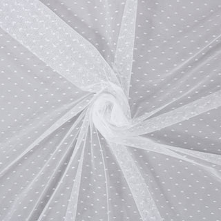 swirl of white polka dot mesh fabric to demonstrate hand and drape