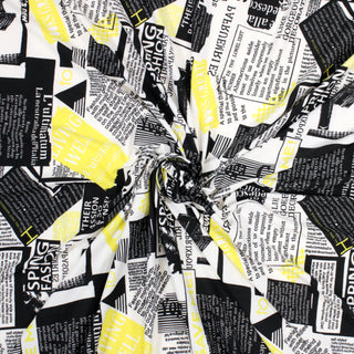 swirl of black, white, and yellow newsprint fabric