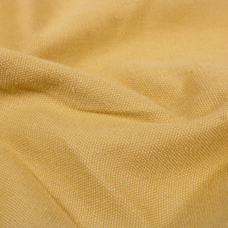 close-up of a pale yolk yellow colored duck canvas, detailing its textured basketweave and durable quality