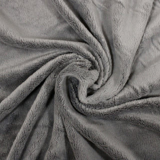 swirl of short-pile faux fur fabric in a light grey color