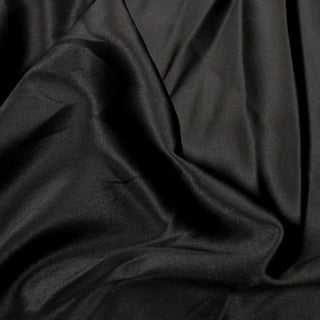 Close-up of black silk stretch charmeuse fabric