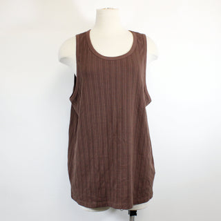 front view of a texture-knit dark brown colored tank top on a mannequin up against a white background