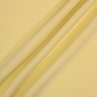 three diagonal lines draped of a butter yellow cady fabric