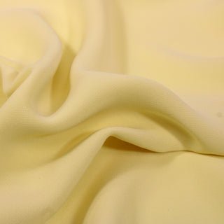 close-up of butter yellow cady fabric
