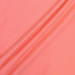 three diagonal lines draped of a coral colored jersey fabric