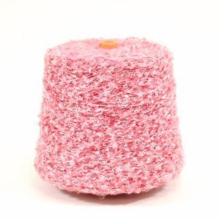 Pink and white loop yarn on a cone on a white background.