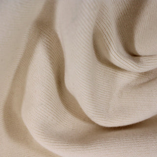 close-up of a natural ecru colored 1x1 rib knit fabric