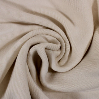 swirl of an ecru colored 1x1 rib knit jersey fabric