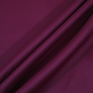 Three lines draped of eggplant purple bengaline fabric.,