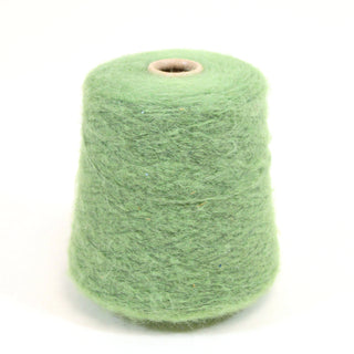 Green mohair yarn cone on a white background.