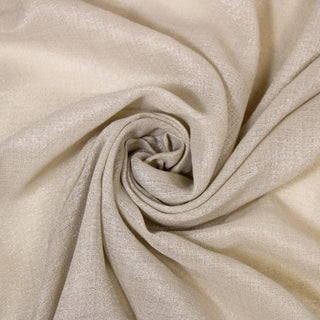 Swirl of a glittery beige gauze fabric, detailing the drape and surface shine.