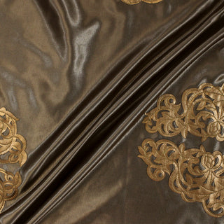 three diagonal lines draped of a satin pleather applique fabric.