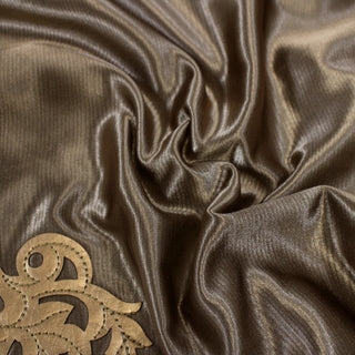 close-up of a satin applique pleather fabric, detailing the surface shine