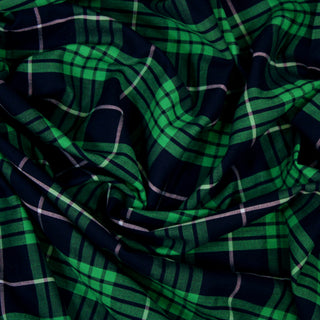 Close up of a green plaid fabric, detailing the drape.