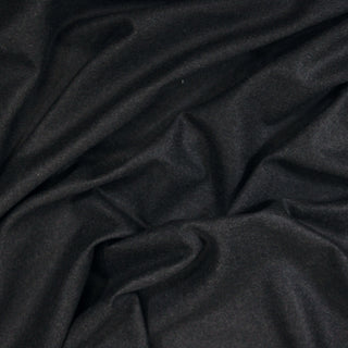 Close up of a grey heathered wool suiting, detailing the surface shine and drape.