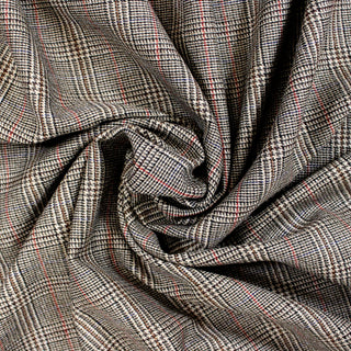 Swirl of a houndstooth plaid suiting, detailing the drape and surface shine.