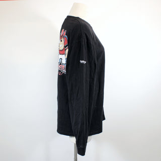 Black long-sleeve shirt with a graphic design on a mannequin against a white background