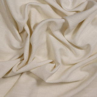 Close up of an ivory burlap fabric, detailing the surface shine and drape.