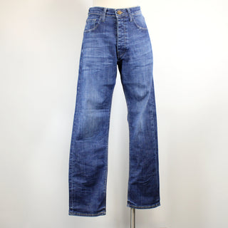 Pair of blue jeans on a mannequin against a white background