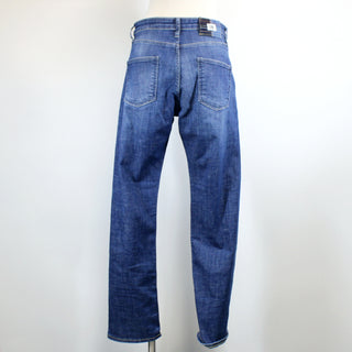 back view of blue jeans on a mannequin against a white background