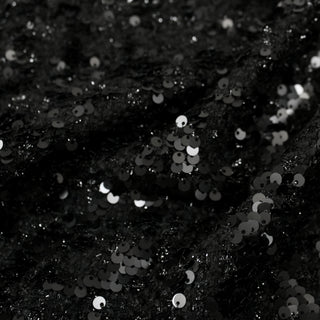 close-up of a matte sequin tweed fabric, detailing the surface shine