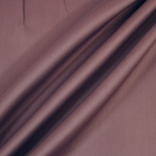 Three lines draped of a mauve bengaline fabric.