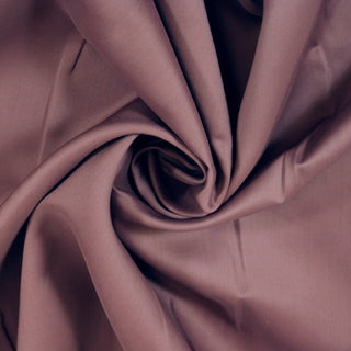 Swirl of mauve bengaline fabric, detailing the drape and surface shine.