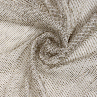 swirl of a metallic mesh fabric, demonstrating the drape and shine of the fabric