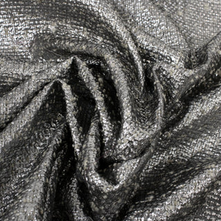 close-up of a silver metallic-coated tweed fabric