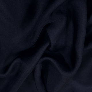 close-up of a dark blue midnight colored silk mikado fabric