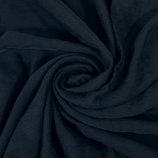 Swirl of a navy twill shirting, detailing the drape and surface shine.