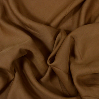 Close up of a brown shirting fabric, detailing the surface shine and drape.