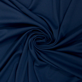 Swirl of a blue tricot knit fabric, detailing the drape.