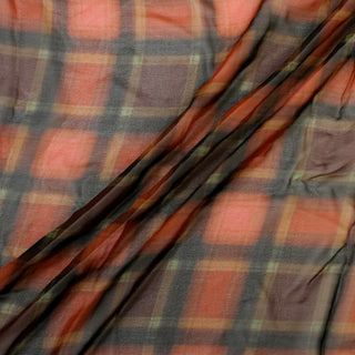 plaid silk chiffon fabric draped in three diagonal lines to show the sheer quality and flowing hand