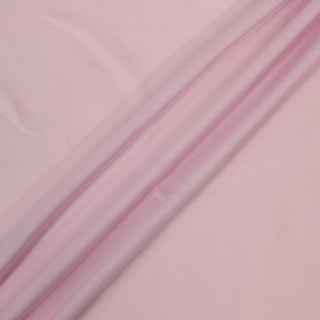 pale orchid silk chiffon fabric with three diagonal lines draped across it diagonally to demonstrate the soft draping hand