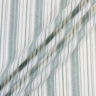 three lines draped of a green and white striped shirting fabric.