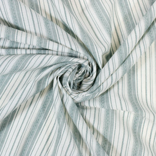 swirl of a green and white striped shirting fabric, detailing the drape and surface shine of the fabric