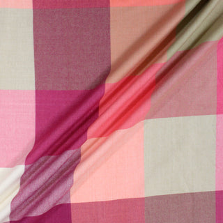 three diagonal lines draped of a pink multi plaid flannel fabric