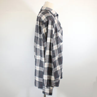 side view of a vintage brushed flannel plaid button up shirt