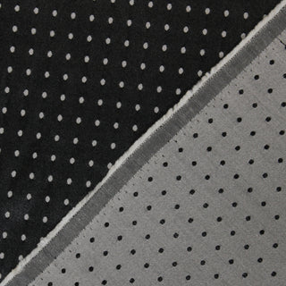 Detail of a polka dot jacquard fabric, showing the wrong side of the fabric.