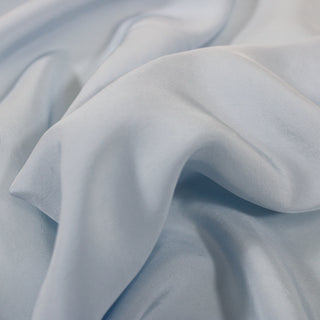 close up of a powder blue rayon crepe, detailing the surface shine.