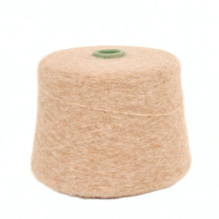 Praline wool yarn on a white background.